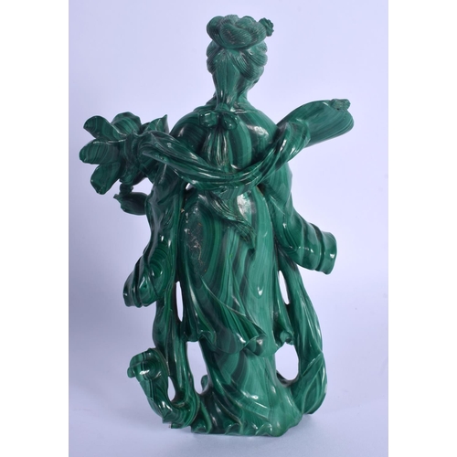 1513 - AN EARLY 20TH CENTURY CHINESE CARVED MALACHITE FIGURE OF GUANYIN Late Qing, modelled holding floral ... 