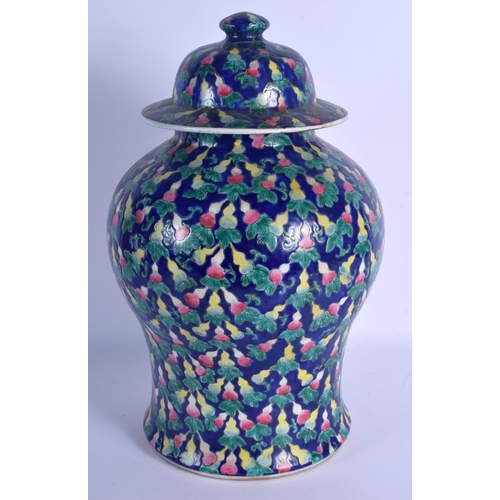 1538 - A LARGE CHINESE FAMILLE ROSE BLUE GLAZED BALUSTER JAR AND COVER 20th Century, painted with gourd sha... 