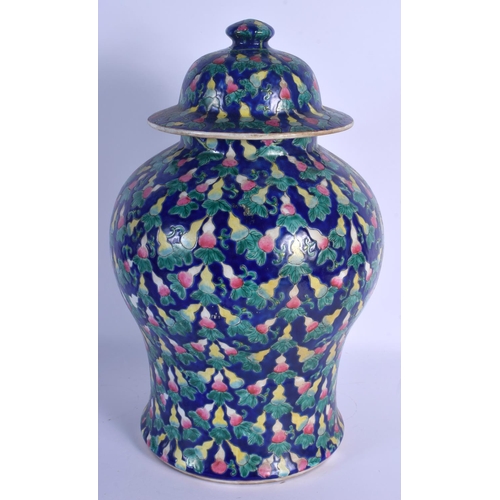 1538 - A LARGE CHINESE FAMILLE ROSE BLUE GLAZED BALUSTER JAR AND COVER 20th Century, painted with gourd sha... 