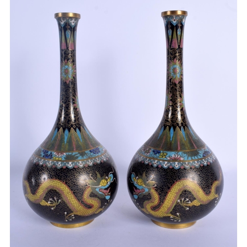 1563 - A PAIR OF 19TH CENTURY CHINESE CLOISONNE ENAMEL BULBOUS VASES Qing, decorated with dragons amongst f... 