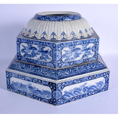 1566 - AN UNUSUAL 19TH CENTURY JAPANESE MEIJI PERIOD BLUE AND WHITE STAND painted with dragons and floral s... 