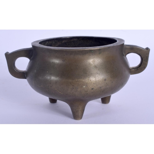 1588 - AN 18TH CENTURY CHINESE TWIN HANDLED BRONZE CENSER Qing, bearing Xuande marks to base. 275 grams. 10... 