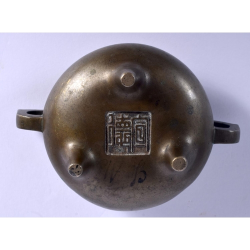 1588 - AN 18TH CENTURY CHINESE TWIN HANDLED BRONZE CENSER Qing, bearing Xuande marks to base. 275 grams. 10... 