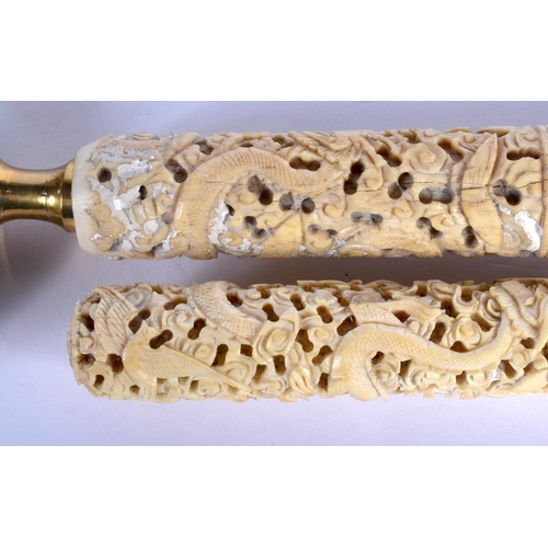 1591 - A PAIR OF 19TH CENTURY CHINESE CARVED CANTON IVORY MAGNIFYING GLASSES decorated with dragons and fol... 