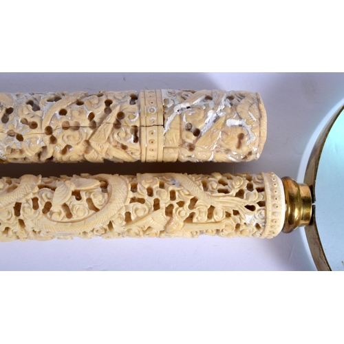 1591 - A PAIR OF 19TH CENTURY CHINESE CARVED CANTON IVORY MAGNIFYING GLASSES decorated with dragons and fol... 