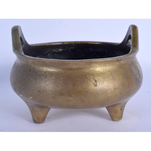 1596 - AN 18TH CENTURY CHINESE TWIN HANDLED BRONZE CENSER Qing, bearing Xuande marks to base, of plain form... 