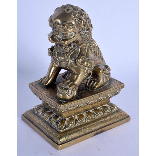 1606 - AN 18TH CENTURY CHINESE BRONZE FIGURE OF A BUDDHISTIC LION Qing. 11 cm x 7 cm.