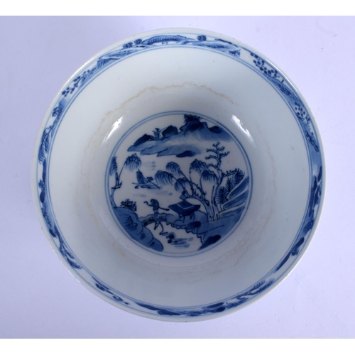 1611 - A 19TH CENTURY CHINESE BLUE AND WHITE PORCELAIN BOWL bearing Kangxi marks to base, painted with land... 