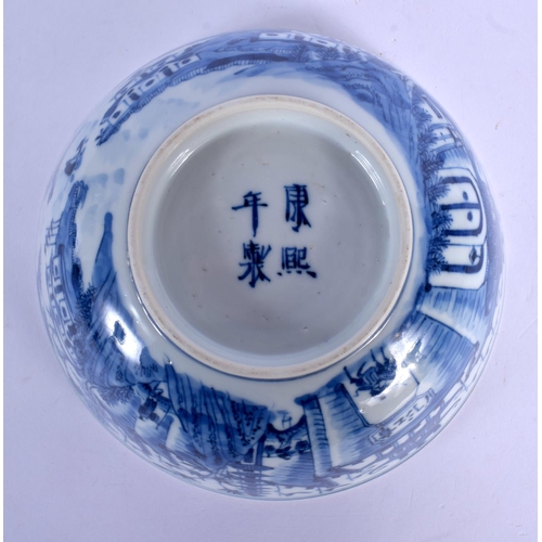 1611 - A 19TH CENTURY CHINESE BLUE AND WHITE PORCELAIN BOWL bearing Kangxi marks to base, painted with land... 