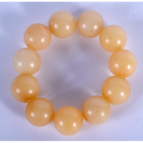 1649 - A CHINESE CARVED GREYISH WHITE JADE BEAD BRACELET 20th Century. 7 cm wide.