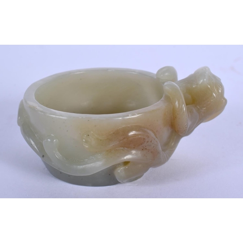 1651 - AN EARLY 20TH CENTURY CHINESE CARVED GREEN JADE LIBATION CUP Late Qing. 7 cm x 2 cm.