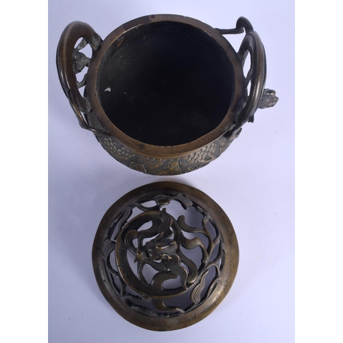 1653 - A LARGE 19TH CENTURY CHINESE TWIN HANDLED BRONZE CENSER AND COVER Qing, decorated with figures and l... 