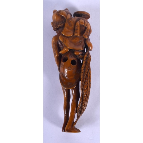 1666 - A LARGE 19TH CENTURY JAPANESE MEIJI PERIOD STAINED IVORY NETSUKE modelled as oni with a farmer upon ... 