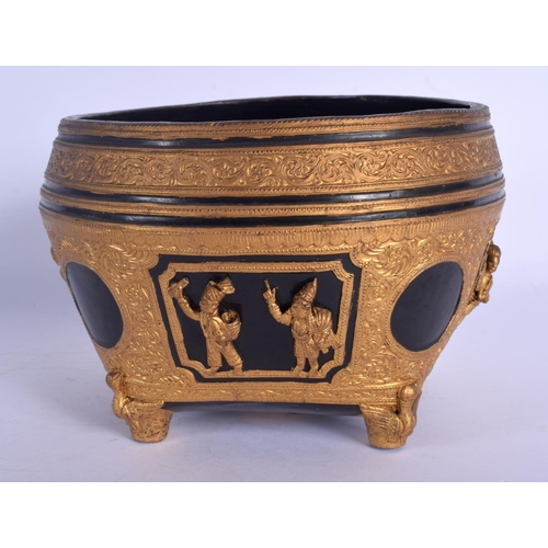 1681 - AN EARLY 20TH CENTURY THAI ASIAN GILT LACQUERED ALMS BOWL decorated with figures. 11 cm x 4 cm.