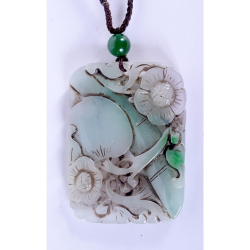 1690 - A CHINESE CARVED JADEITE PENDANT 20th Century. 5.5 cm x 4 cm.