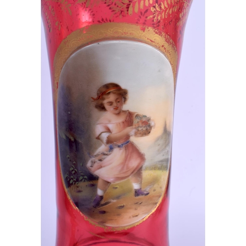 17 - A PAIR OF 19TH CENTURY BOHEMIAN RUBY GLASS VASES painted with girls within landscapes. 27 cm high.