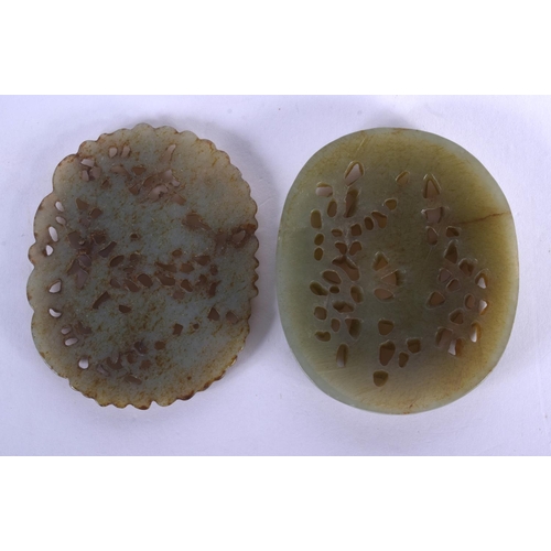 1722 - TWO EARLY 20TH CENTURY CHINESE CARVED JADE PLAQUES Late Qing. 5 cm diameter. (2)