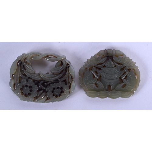 1731 - TWO EARLY 20TH CENTURY CHINESE CARVED JADE PLAQUES Late Qing. 5 cm diameter. (2)