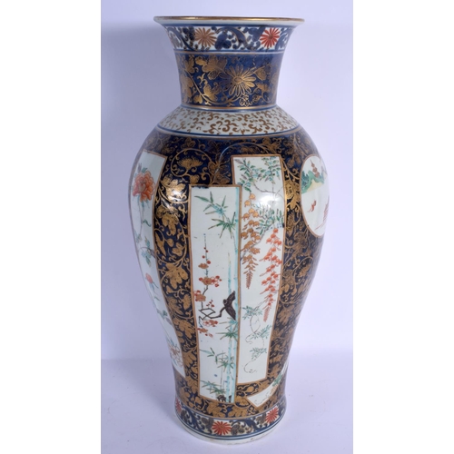 1742 - A RARE LARGE 18TH CENTURY JAPANESE EDO PERIOD IMARI BALUSTER VASE painted with buildings and landsca... 