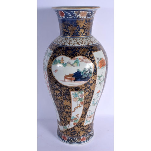 1742 - A RARE LARGE 18TH CENTURY JAPANESE EDO PERIOD IMARI BALUSTER VASE painted with buildings and landsca... 