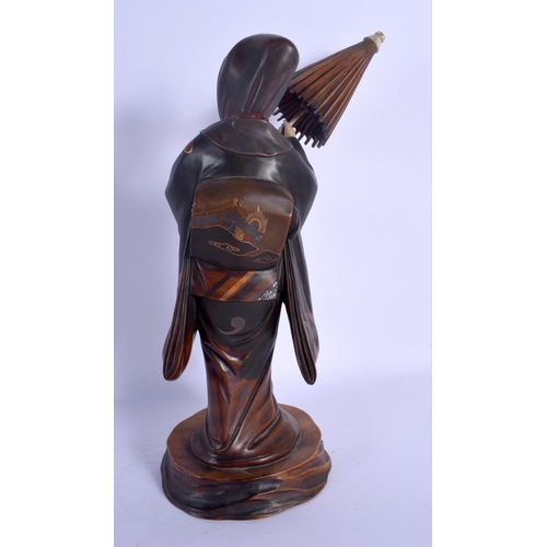 1761 - A 19TH CENTURY JAPANESE MEIJI PERIOD LACQUERED IVORY FIGURE OF A FEMALE modelled holding a parasol. ... 