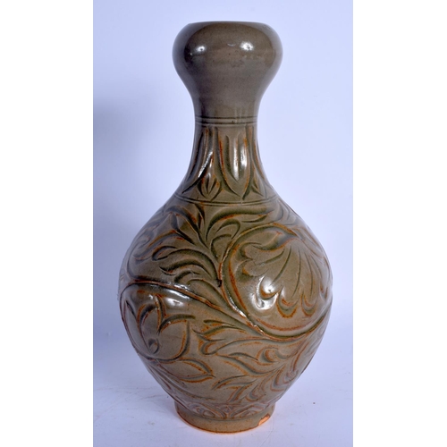 1773 - A 19TH CENTURY CHINESE CARVED CELADON VASE decorated with foliage. 23 cm high.