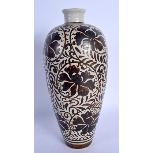 1796 - A CHINESE QING DYNASTY CHIZOU POTTERY VASE painted with brown floral sprays. 29 cm high.