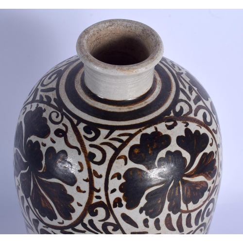 1796 - A CHINESE QING DYNASTY CHIZOU POTTERY VASE painted with brown floral sprays. 29 cm high.