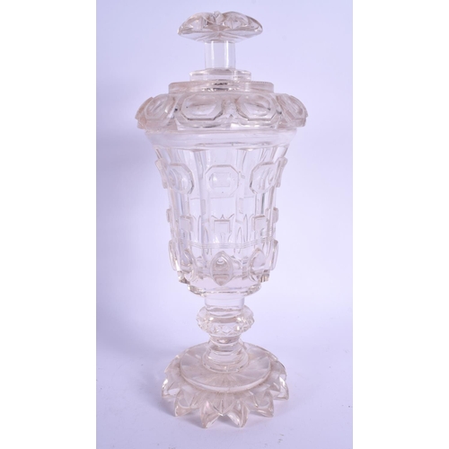 18 - AN EARLY 19TH CENTURY BOHEMIAN CRYSTAL GLASS JAR AND COVER with well cut base. 31 cm high.