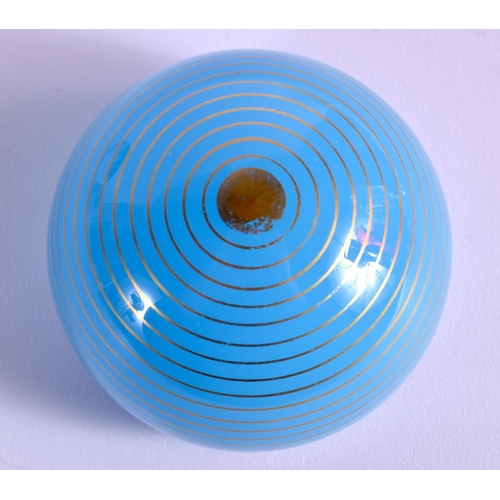 21 - AN UNUSUAL BACCARAT BLUE SWIRL GLASS PAPERWEIGHT. 5.5 cm wide.