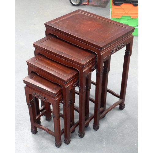 2180 - A NEST OF 19TH CENTURY CHINESE ROSEWOOD TABLES. Largest 70 cm x 40 cm. (4)