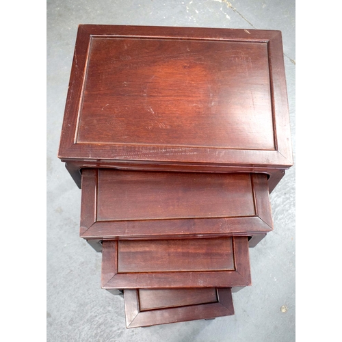 2180 - A NEST OF 19TH CENTURY CHINESE ROSEWOOD TABLES. Largest 70 cm x 40 cm. (4)