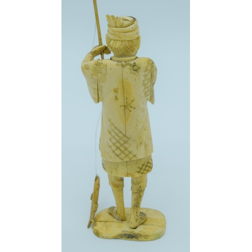 4019 - A small Japanese Meiji Period Ivory figure of a fisherman 20cm .