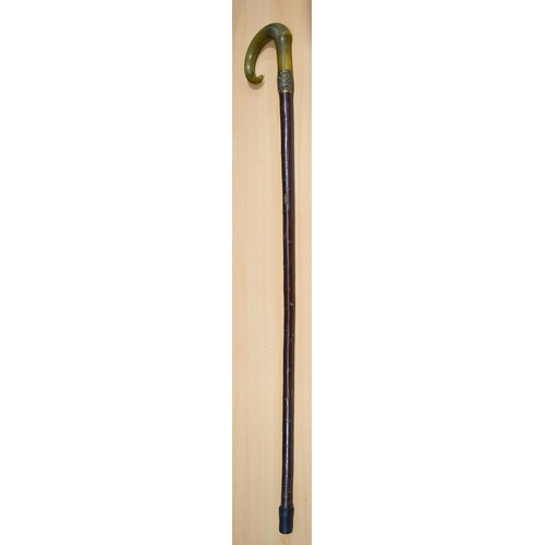 4093 - A Rhino horn handled walking cane with a yellow metal embossed collar 98cm.