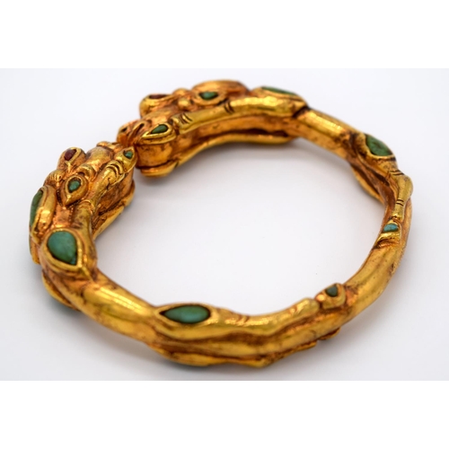 4207 - A Chinese yellow metal dragon bracelet inlaid with turquoise stones 7.5 x 6.5cm