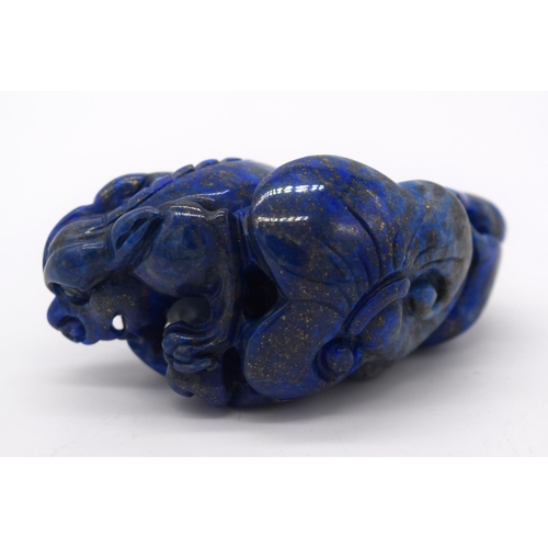 4214 - A carved Lapis Lazuli bolder in the form of a dragon 6cm.