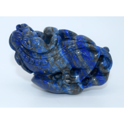 4214 - A carved Lapis Lazuli bolder in the form of a dragon 6cm.