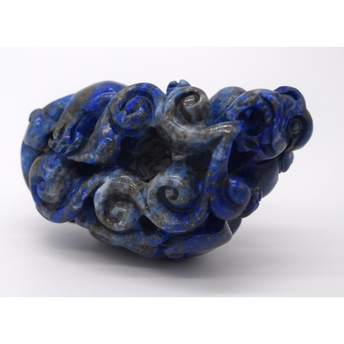 4214 - A carved Lapis Lazuli bolder in the form of a dragon 6cm.