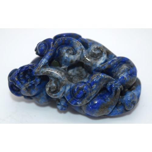 4214 - A carved Lapis Lazuli bolder in the form of a dragon 6cm.