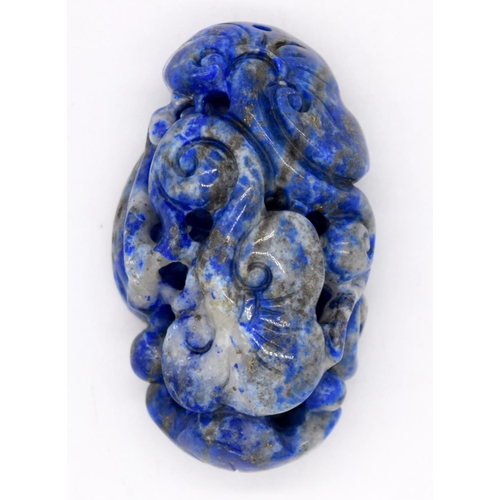 4215 - A carved Lapis Lazuli bolder in the form of a monkey 6cm.