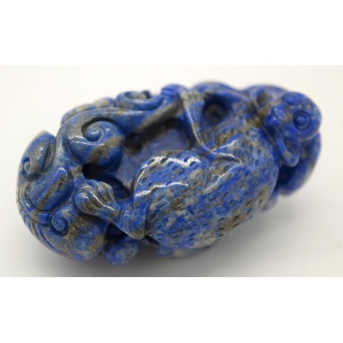 4215 - A carved Lapis Lazuli bolder in the form of a monkey 6cm.