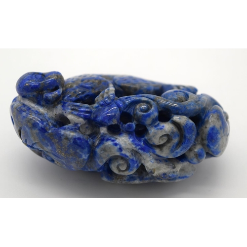 4215 - A carved Lapis Lazuli bolder in the form of a monkey 6cm.