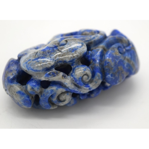 4215 - A carved Lapis Lazuli bolder in the form of a monkey 6cm.