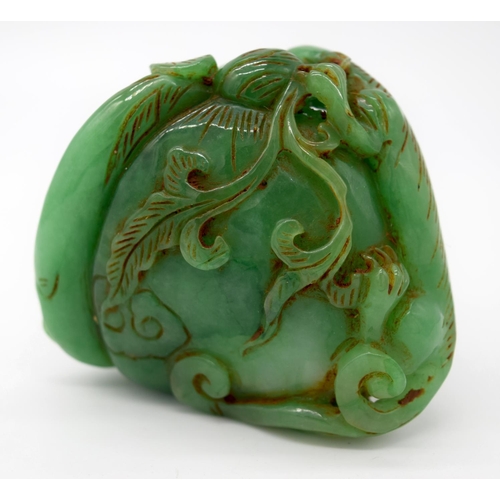 4217 - A carved jade bolder decorated with foliage and reptiles 6 x 6 cm.