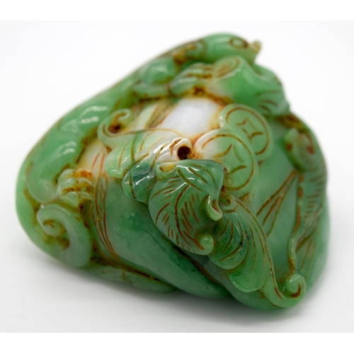 4217 - A carved jade bolder decorated with foliage and reptiles 6 x 6 cm.