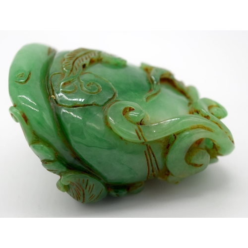 4217 - A carved jade bolder decorated with foliage and reptiles 6 x 6 cm.