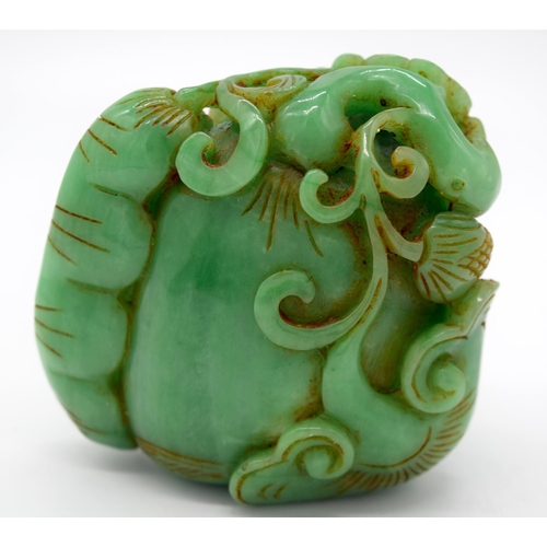 4218 - A carved jade bolder decorated with foliage 7 x 7 cm.