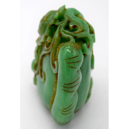 4218 - A carved jade bolder decorated with foliage 7 x 7 cm.