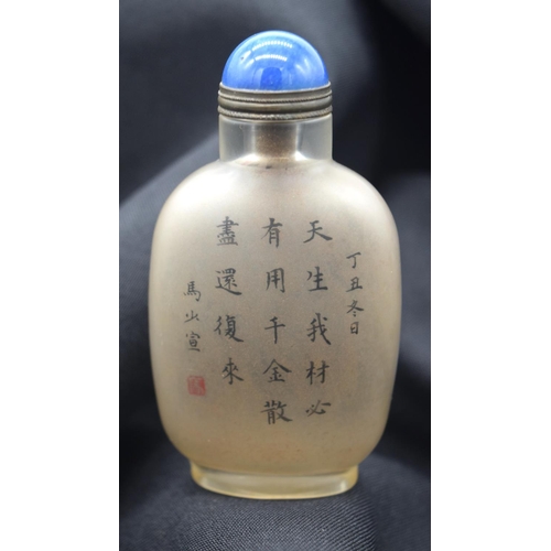 4222 - A Chinese glass snuff bottle with Calligraphy and a European figure 9cm.