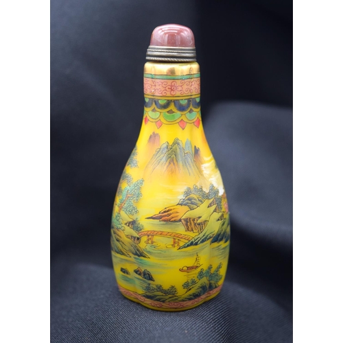 4224 - A Chinese glass snuff bottle decorated with  mountains  birds and foliage 9 cm .